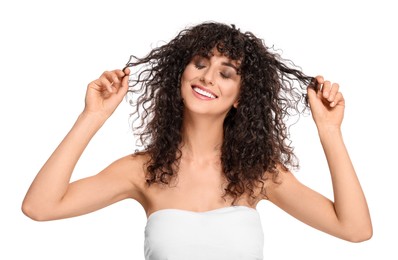 Beautiful young woman with long curly hair on white background