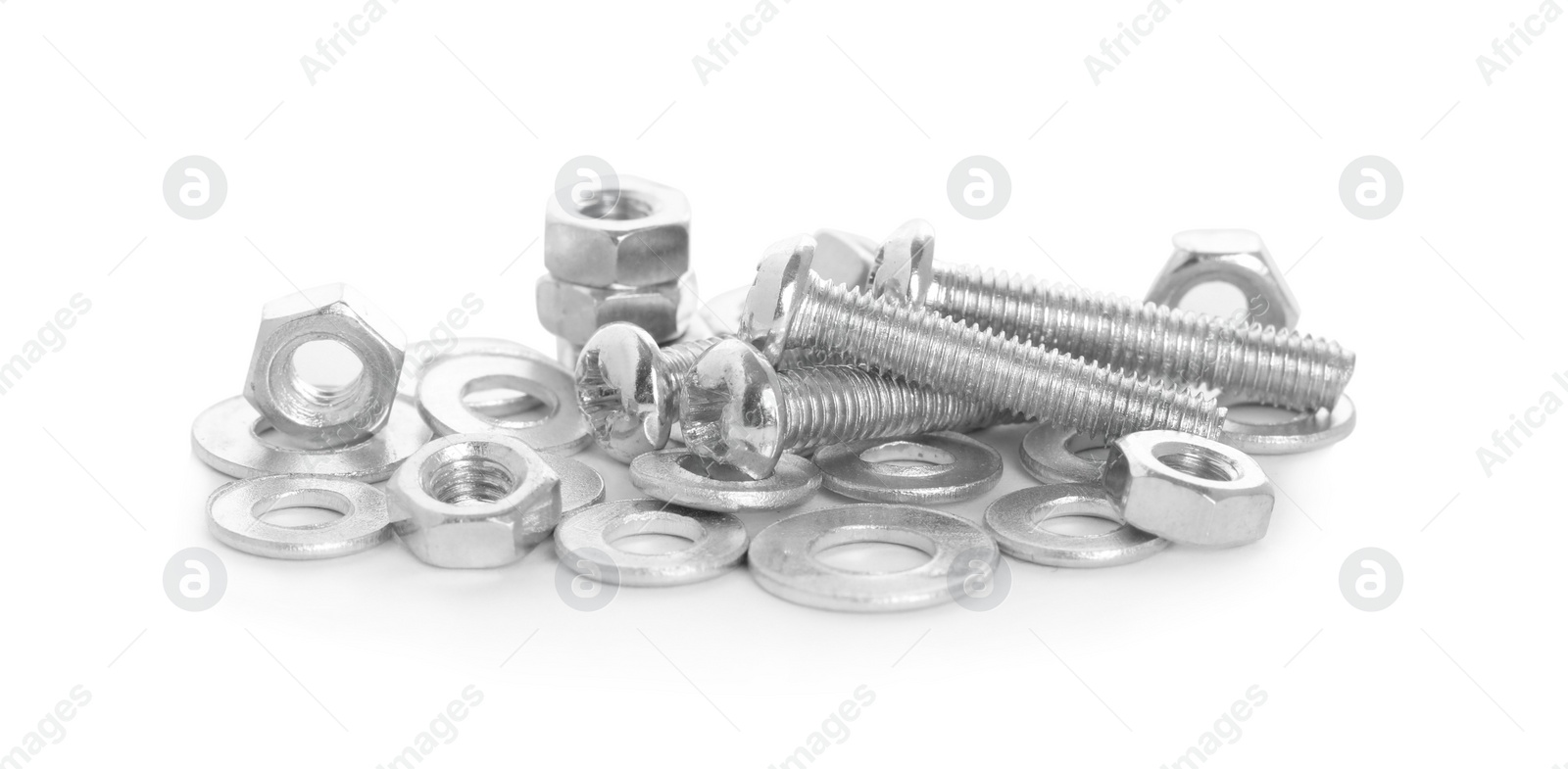 Photo of Many metal bolts and nuts on white background
