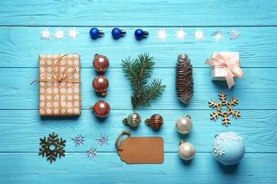 Photo of Flat lay composition with Christmas decorations on blue wooden background. Winter season