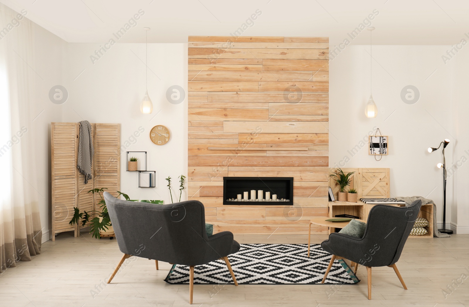 Photo of Living room interior with decorative fireplace in wooden wall