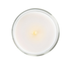 Burning candle in glass holder on white background, top view