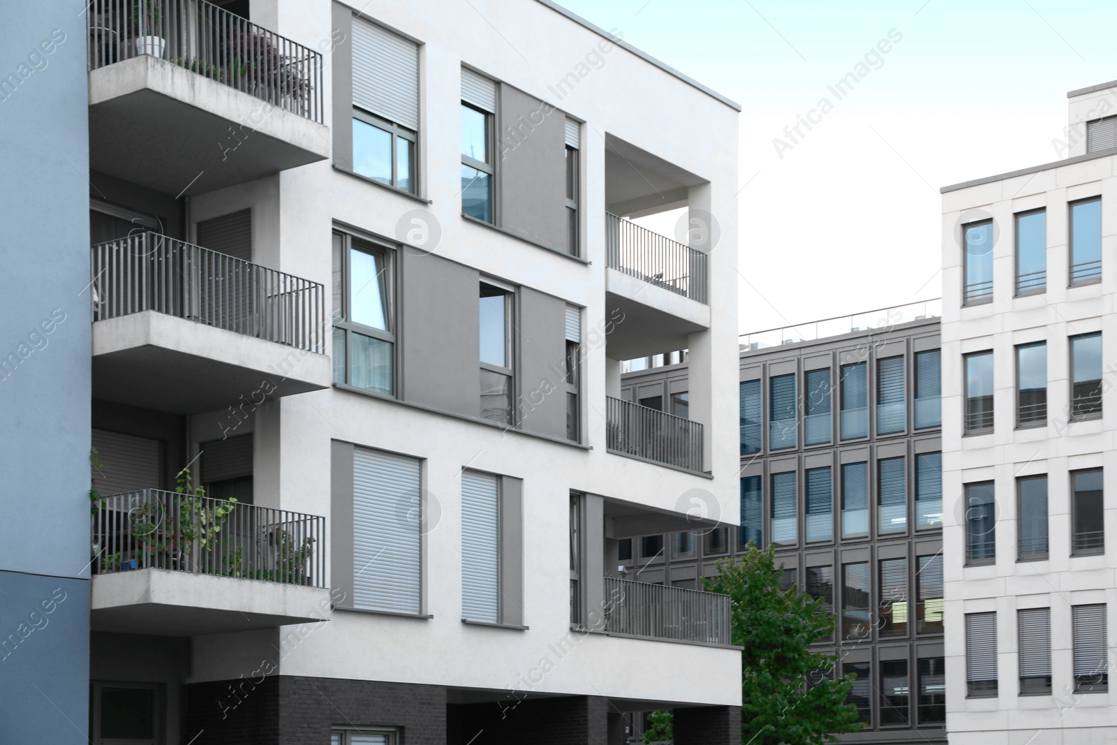 Photo of Beautiful view of modern buildings with big windows outdoors