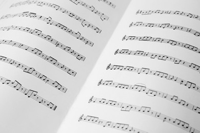 Photo of Sheet music book as background, closeup view