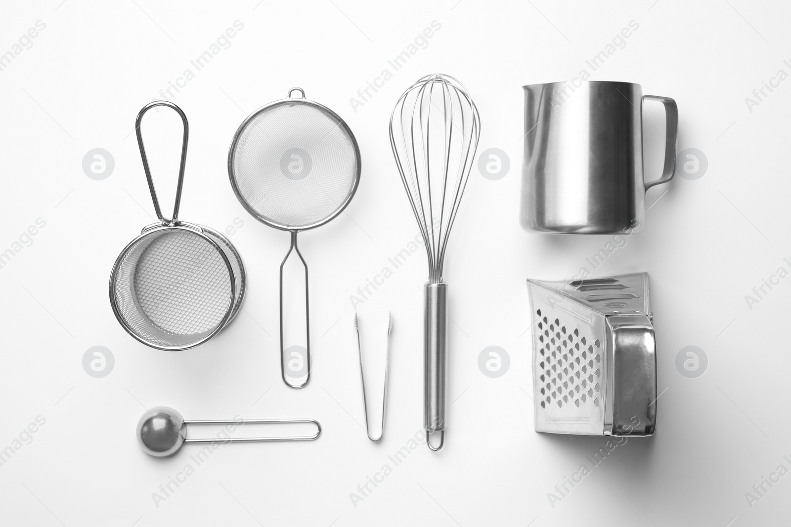 Photo of Set of modern cooking utensils on white background, top view