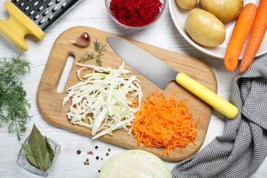 Fresh ingredients for borscht on white wooden table, flat lay