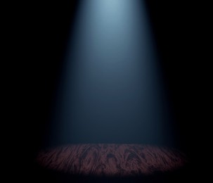 Image of Bright spotlight in dark room. Performance equipment