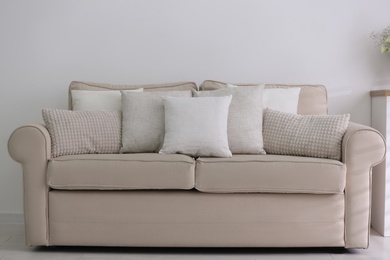 Photo of Sofa with pillows in modern living room