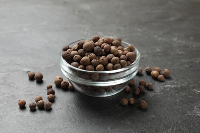 Dry allspice berries (Jamaica pepper) on black table