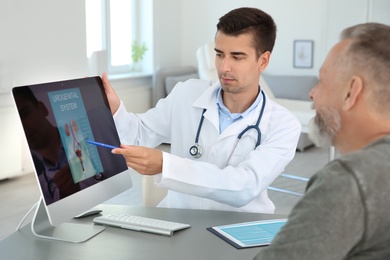 Photo of Man with health problem visiting urologist at hospital