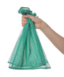 Photo of Woman holding net bag on white background, closeup. Conscious consumption