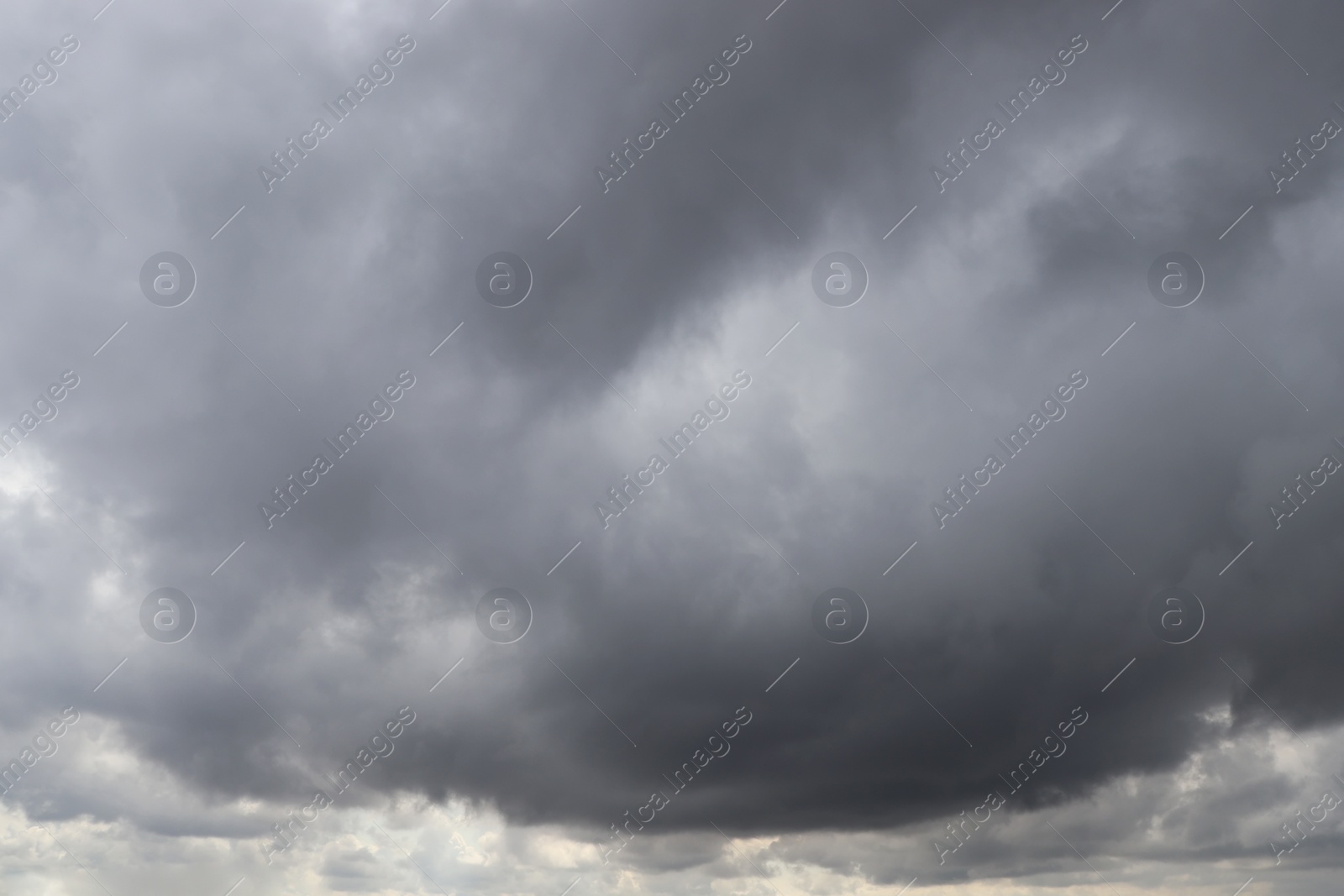 Photo of Sky with heavy rainy clouds on grey day