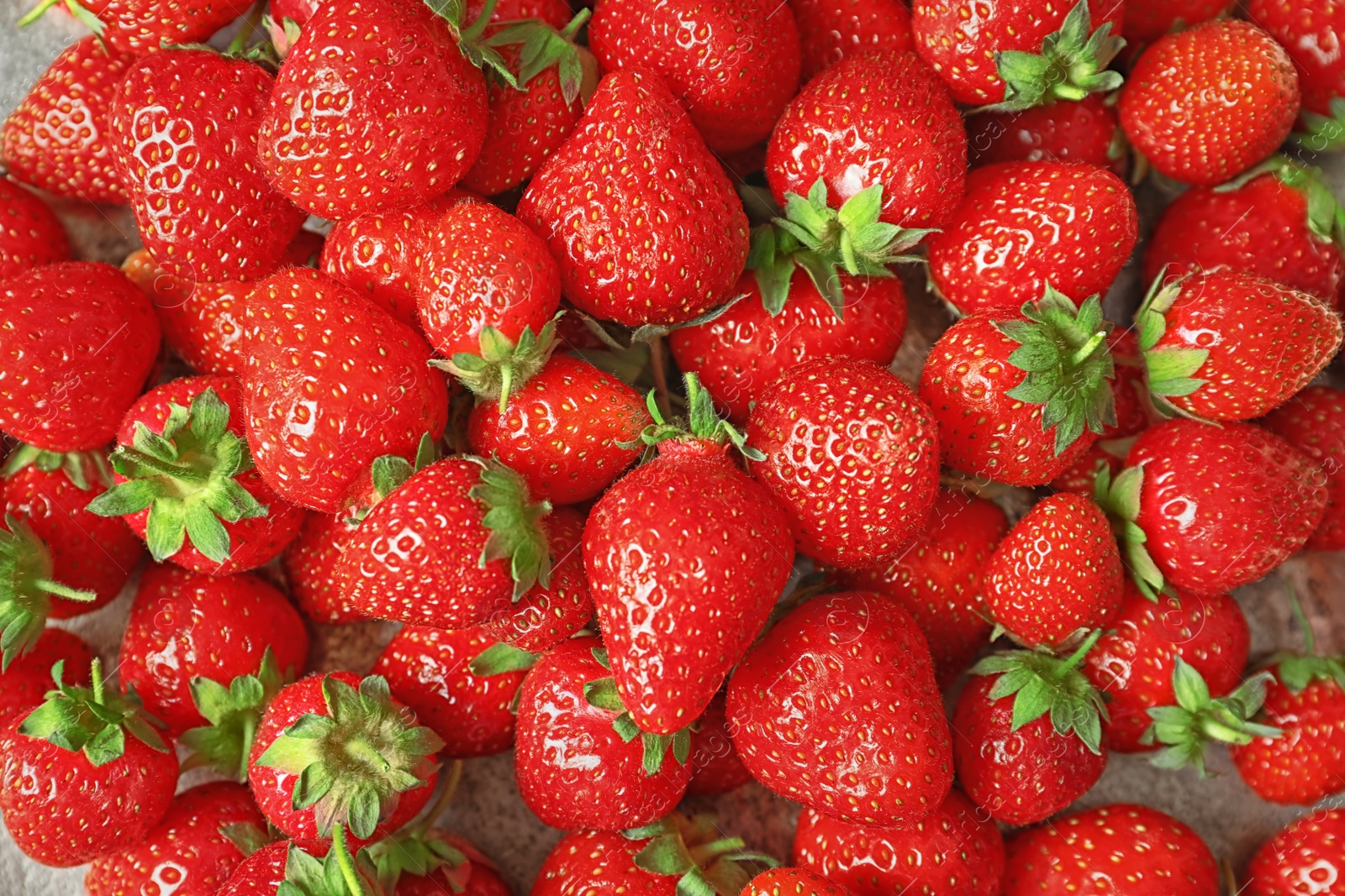 Photo of Heap of ripe red strawberries, top view