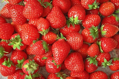 Heap of ripe red strawberries, top view