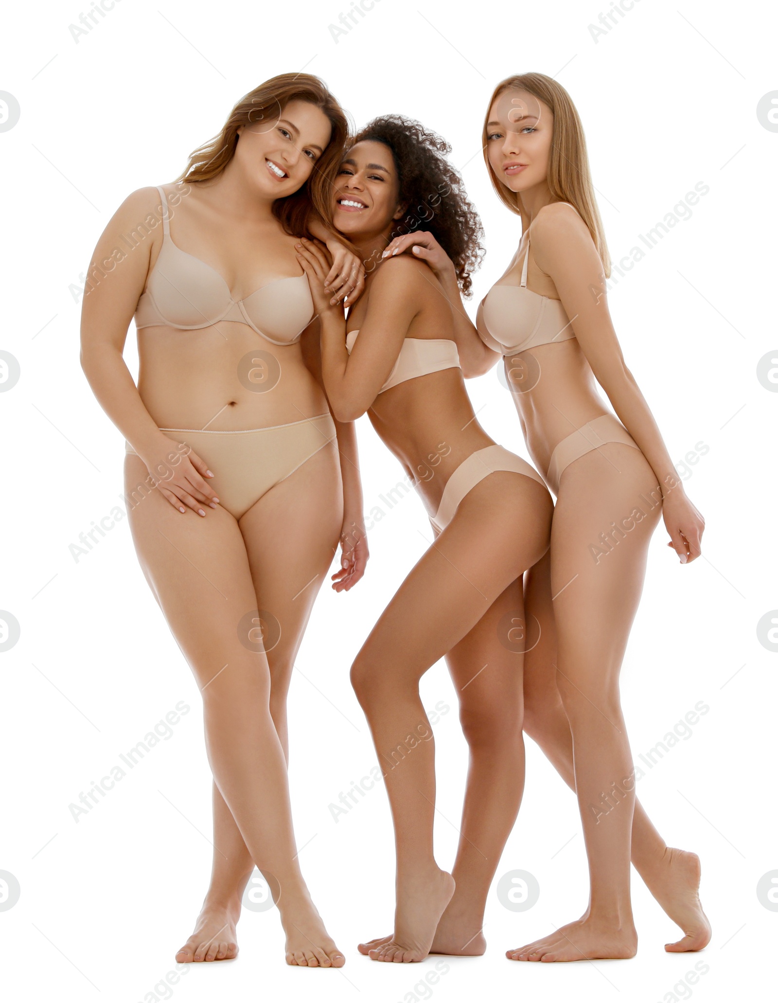 Photo of Group of women with different body types in underwear on white background