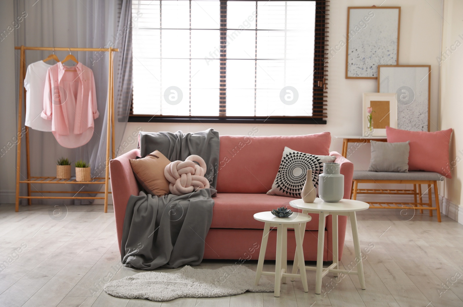 Photo of Interior of cozy living room with comfortable sofa