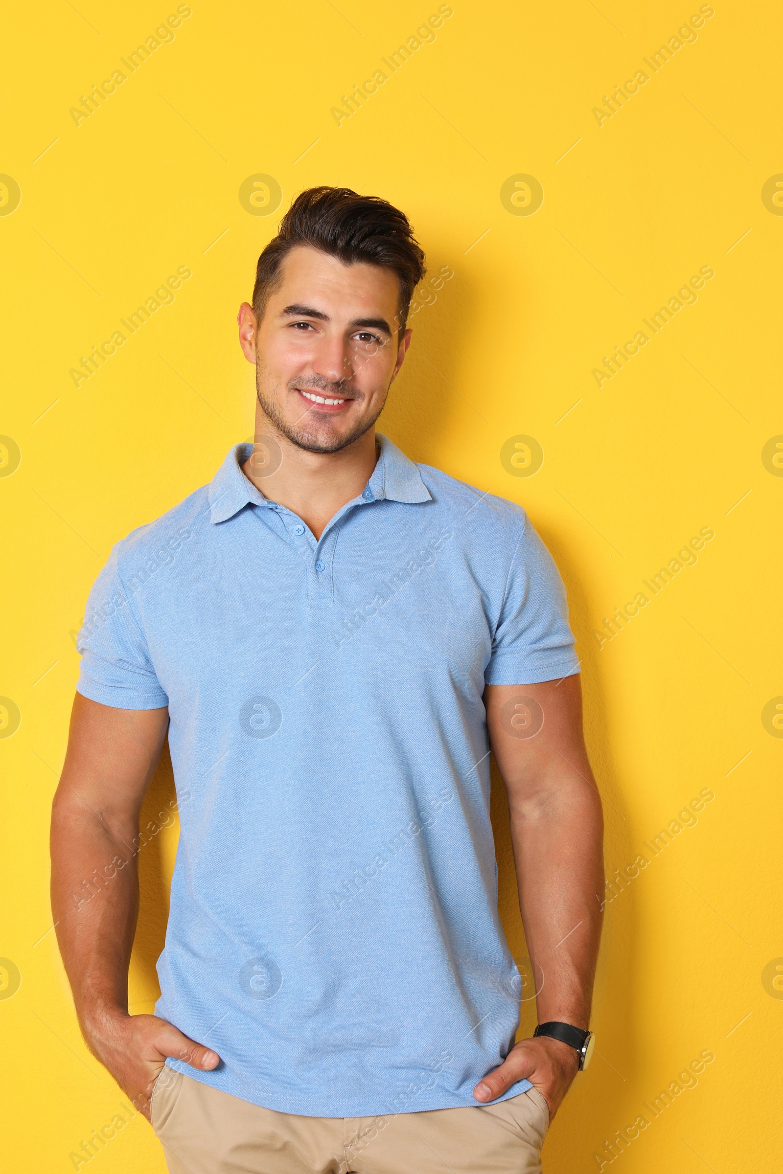 Photo of Portrait of handsome young man on color background