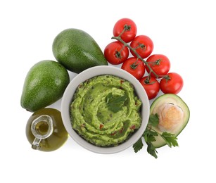 Photo of Delicious guacamole and ingredients isolated on white, top view