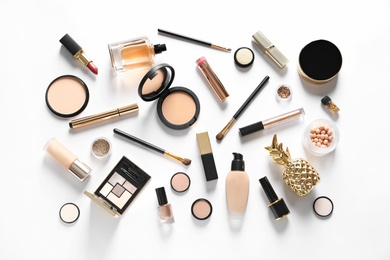 Set of luxury makeup products on white background, top view