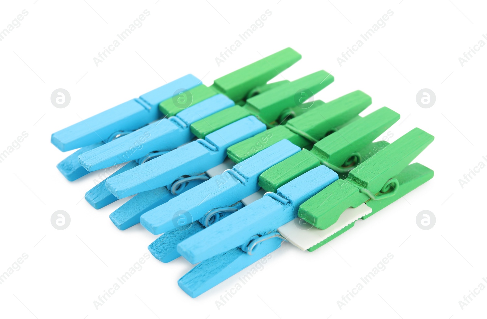 Photo of Set of colorful wooden clothespins on white background
