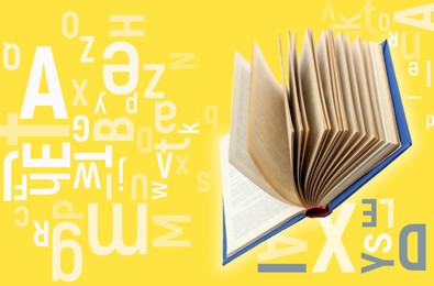 Image of Flying open book with letters on yellow background. Dyslexia concept
