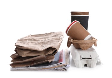 Photo of Pile of cardboard and paper garbage on white background. Recycling rubbish