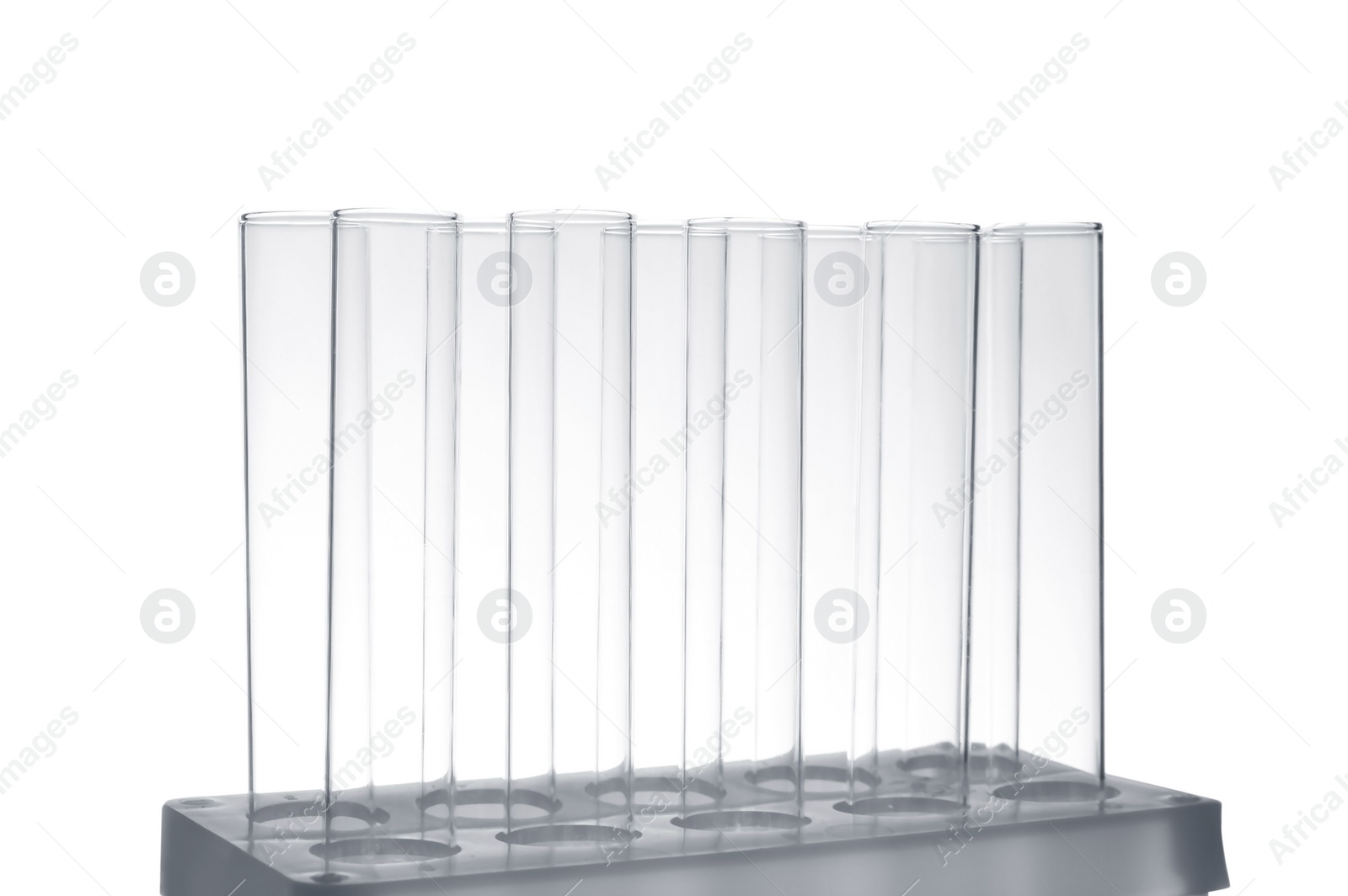 Photo of Empty test tubes in holder on white background. Laboratory analysis