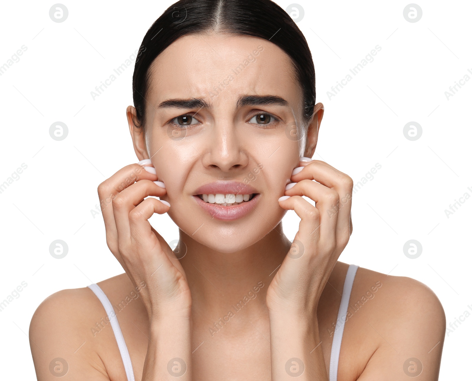 Photo of Woman with dry skin scratching her face on white background