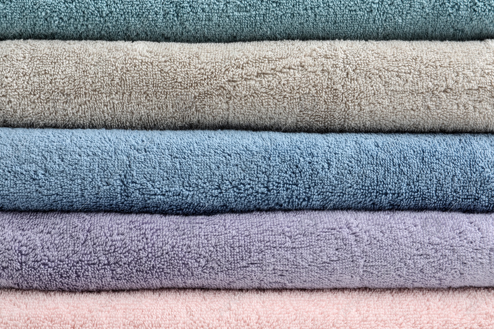 Photo of Stack of clean terry towels as background