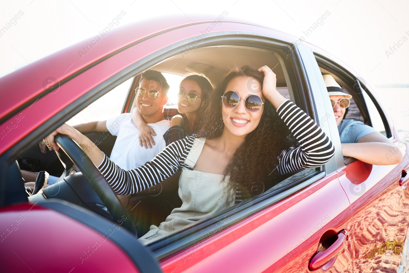 Photo of Happy friends together in car on road trip