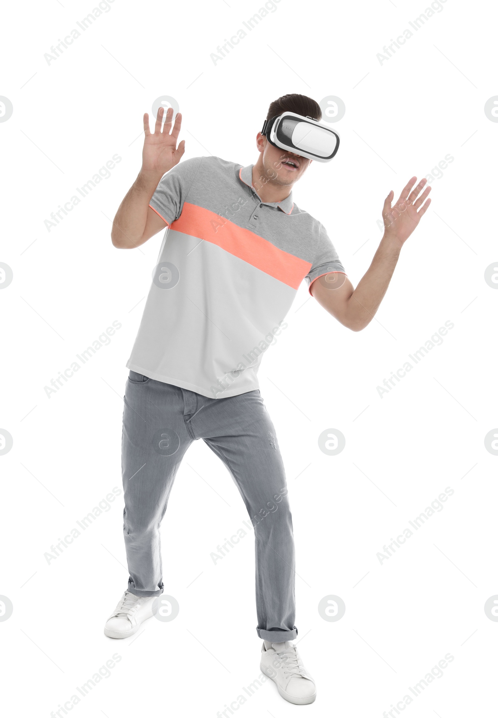 Photo of Man using virtual reality headset on white background