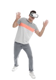 Man using virtual reality headset on white background