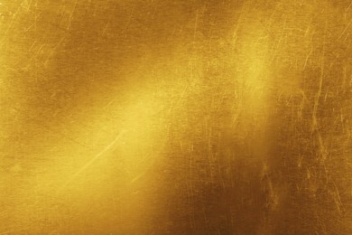 Image of Golden textured surface as background, closeup view