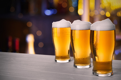 Image of Fresh cold beer on table in pub