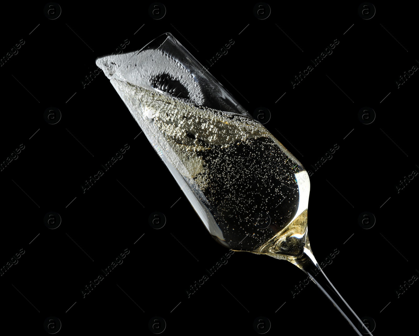 Photo of Glass of fizzy champagne on black background, closeup