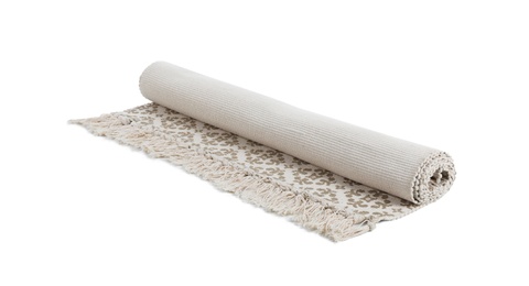 Photo of Rolled carpet with ornament on white background. Interior element