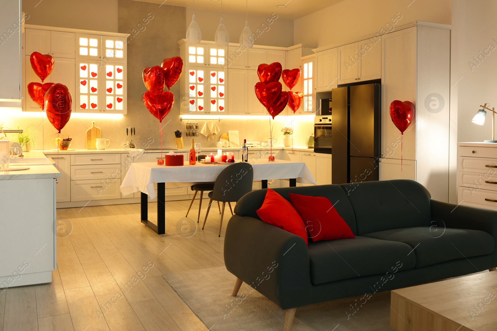 Photo of Romantic atmosphere. Cosy kitchen with set table decorated for Valentine day