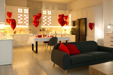 Romantic atmosphere. Cosy kitchen with set table decorated for Valentine day