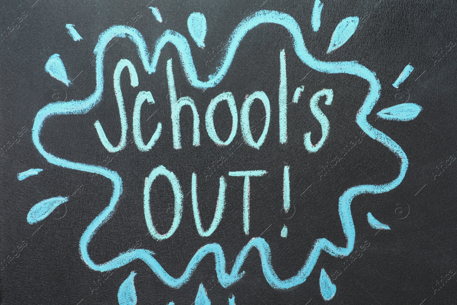 Photo of Text School's Out written on black chalkboard. Summer holidays