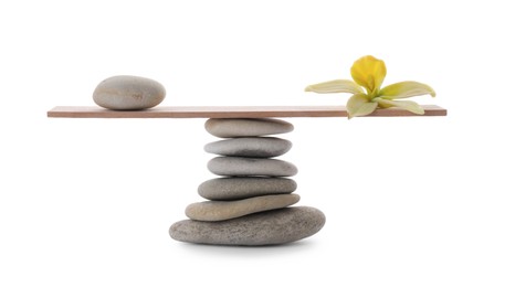 Photo of Stack of stones, small plank and orchid flower on white background. Balance concept