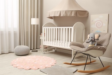 Photo of Modern baby room interior with stylish crib