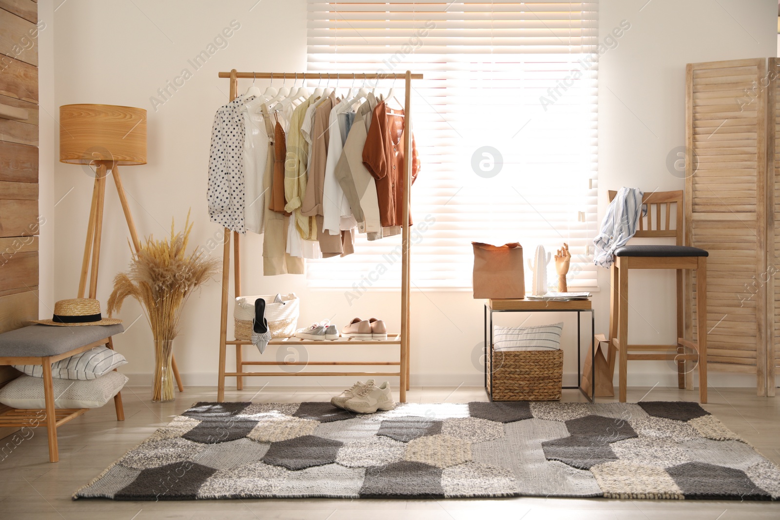 Photo of Dressing room interior with stylish wooden furniture