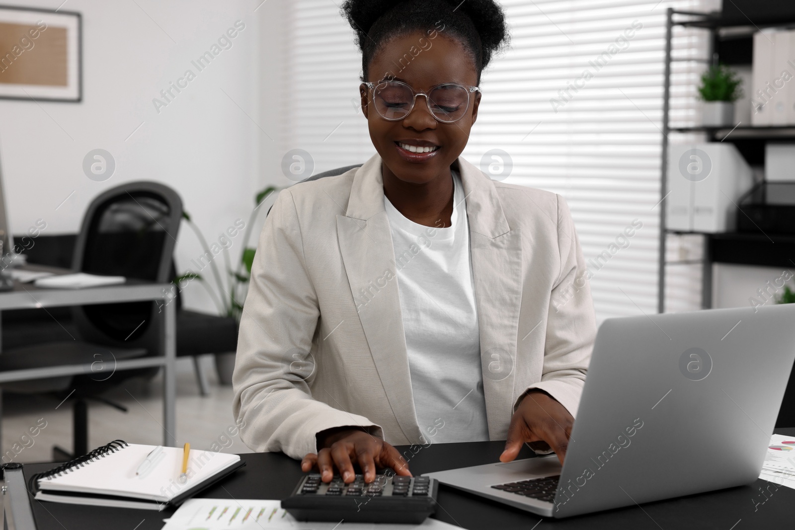 Photo of Professional accountant working at desk in office