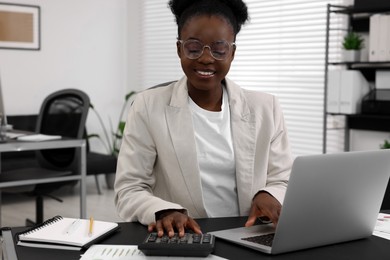 Professional accountant working at desk in office