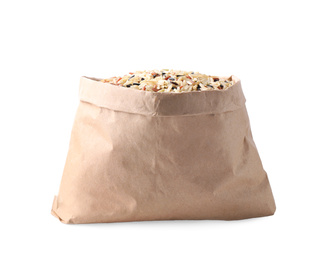 Photo of Mix of brown rice in paper bag isolated on white