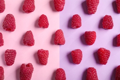 Tasty ripe juicy raspberries on color background, flat lay