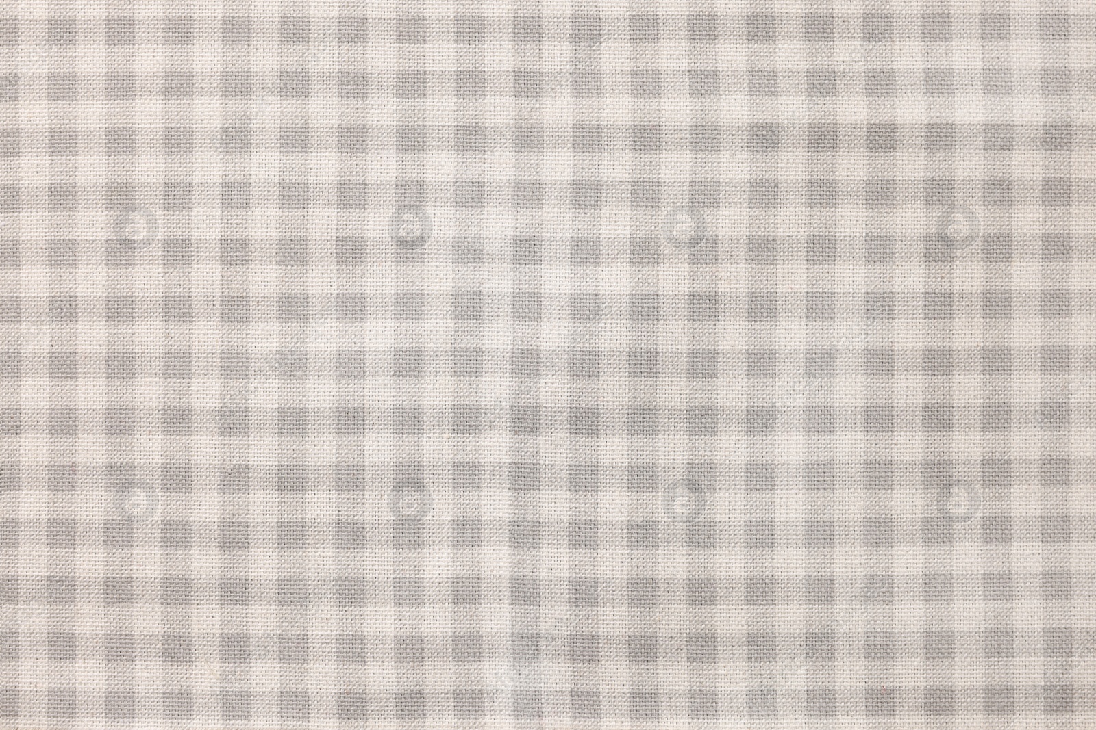 Photo of Beige checkered tablecloth as background, top view