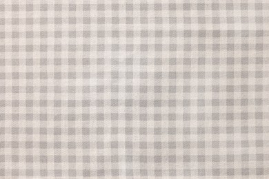 Photo of Beige checkered tablecloth as background, top view