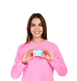 Happy young woman with driving license on white background