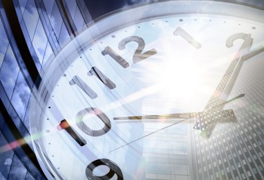 Image of Time related concepts. Double exposure of clock and office buildings