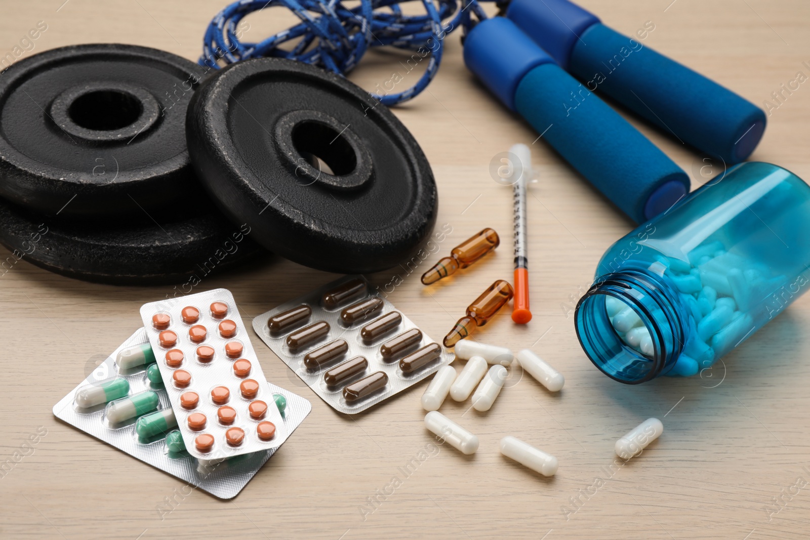 Photo of Composition with drugs on wooden table. Doping control